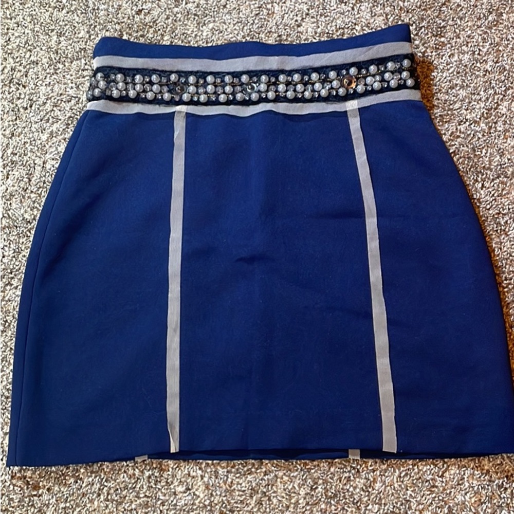 Navy blue mini skirt with embellished belt